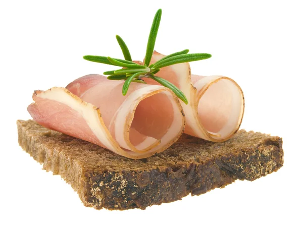 Slices of ham with rosemary — Stock Photo, Image