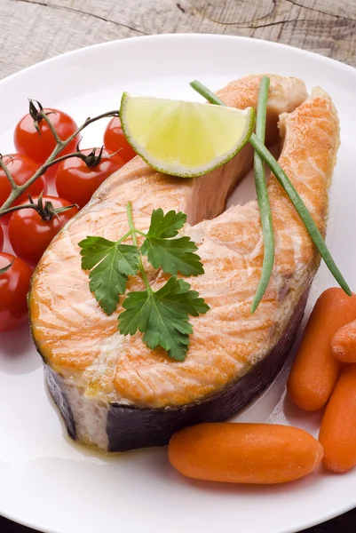 Salmon on white plate — Stock Photo, Image