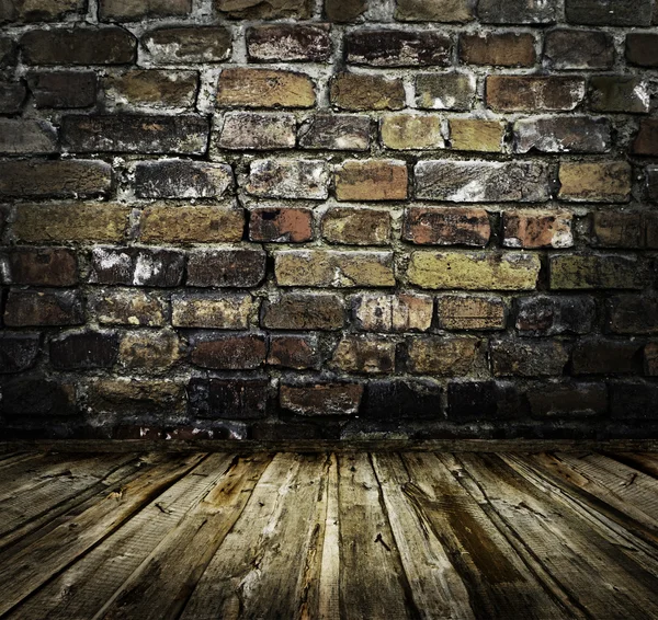 Brick wall and wooden floor — Stock Photo, Image