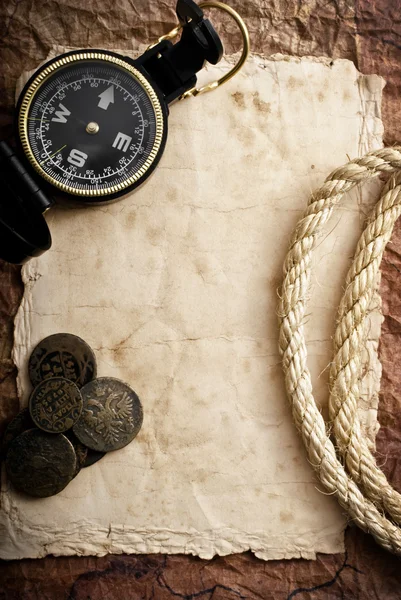 Compass, coins and rope — Stock Photo, Image