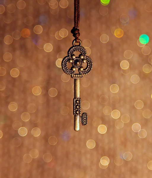 Vintage key on a shiny background — Stock Photo, Image