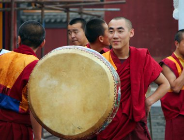 HOHHOT, INNER MONGOLIA - JULE 12: Monks are preparing for the an clipart