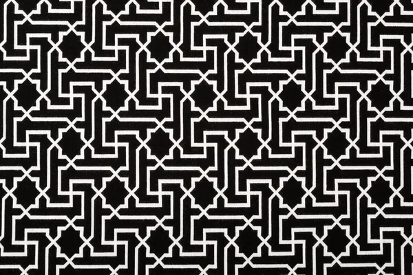 Материал в геометрических узорах, текстильный фон . — стоковое фото