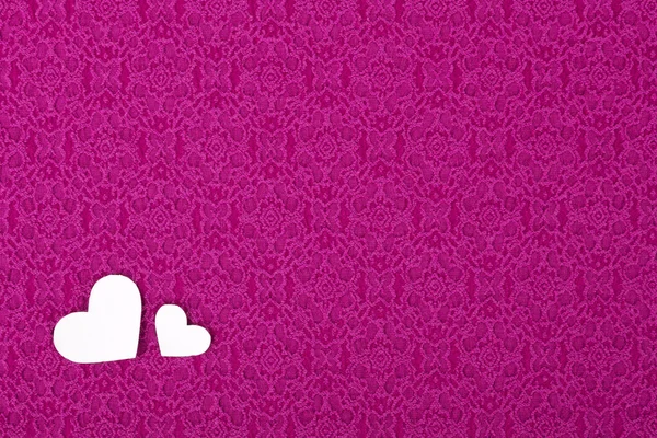 两颗心，一个背景，情人节粉红色材料. — 图库照片