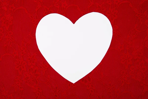 Weißes Herz auf Hintergrund, ein Valentinstag-Thema. — Stockfoto