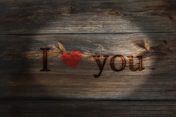 The old plank of spent inscription I love you, a Valentines Day — Stock Photo, Image