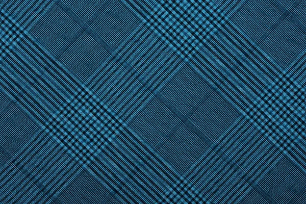 Material azul em padrões geométricos, um fundo — Fotografia de Stock