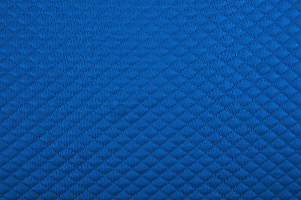 Blue fabric with patterns, a background — Stock Photo, Image