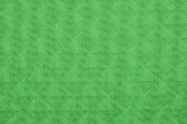 Tecido verde com padrões geométricos, um fundo — Fotografia de Stock