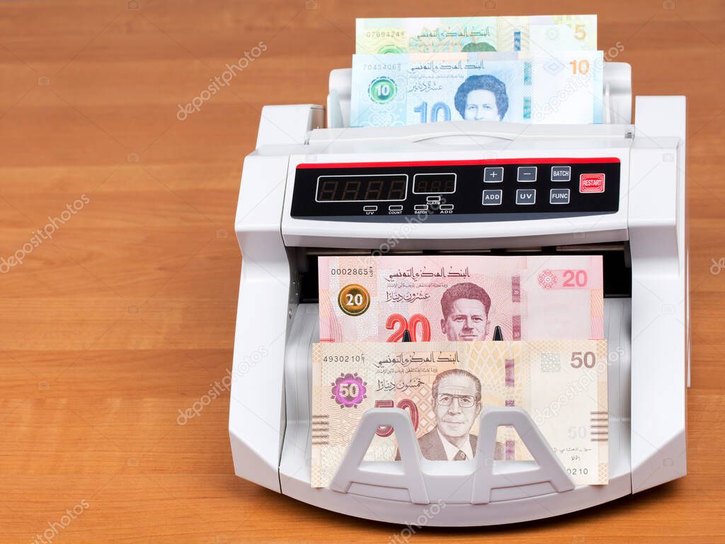 Tunisian money - Dinars  in a counting machine