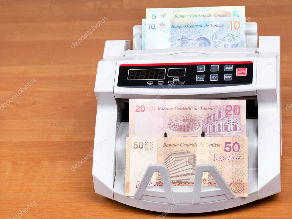 Tunisian money - Dinars in a counting machine