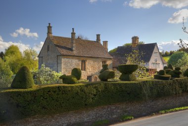 Cotswold House with topiary hedge clipart