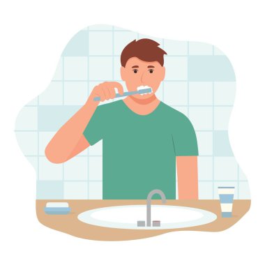  Diş fırçasıyla dişlerini fırçalayan adam..