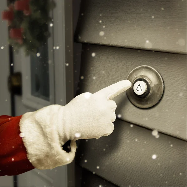 サンタがドアのベルが鳴ってるよ ロイヤリティフリーのストック写真