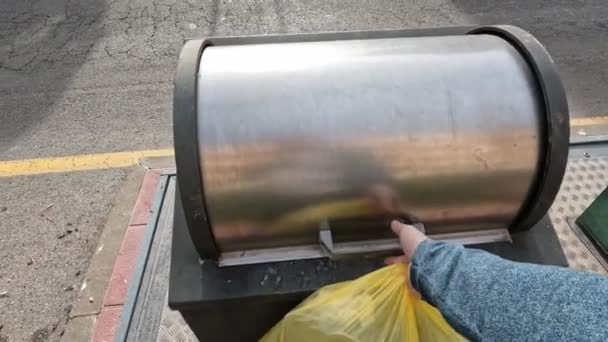 Mans Hand Throws Junk Yellow Bag Trash Can — Wideo stockowe