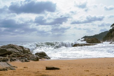High Tides Coming on to the Rocky Shores of Costa Brava in Spain, cloudy weather