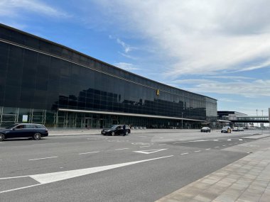 Barcelona, Spain - 04.30.2022: terminal 2 building of Barcelona Airport with some people nearby