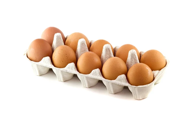 Коричневые яйца в яичной коробке Лицензионные Стоковые Изображения