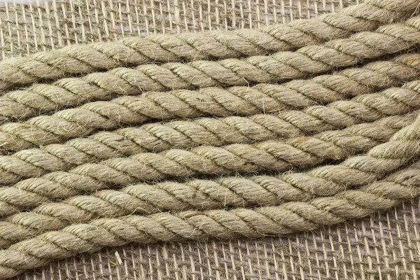 Jute rope on sackcloth — Stock Photo, Image