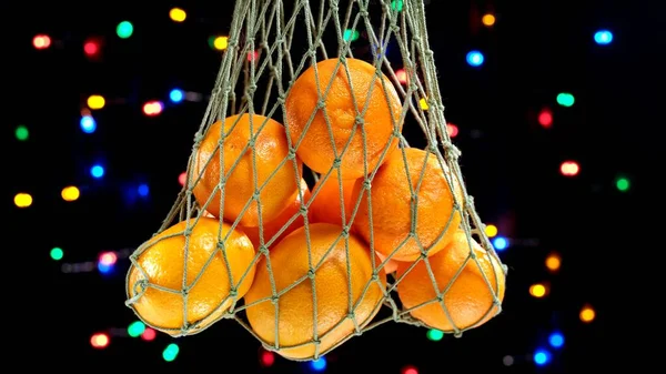 Πράσινη Τσάντα Ματιών Χριστουγεννιάτικα Πορτοκάλια Μανταρίνια Φρούτα Κατά Των Χριστουγέννων — Φωτογραφία Αρχείου