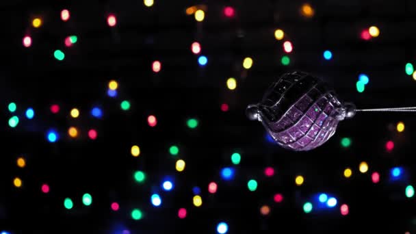 4k. Vertical View. Christmas ball toy, Blinking Garland with defocused lights. — Stockvideo