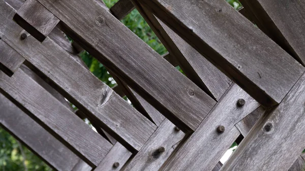 Abstract Weathered Wooden Beams Forming Geometric Pattern — Stockfoto