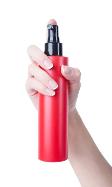 Spray para el cabello botella roja aislada sobre fondo blanco, presionando la mano del hombre — Foto de Stock