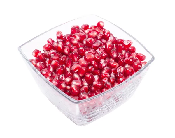 Grains, pomegranate seeds in a vase — Stock Photo, Image