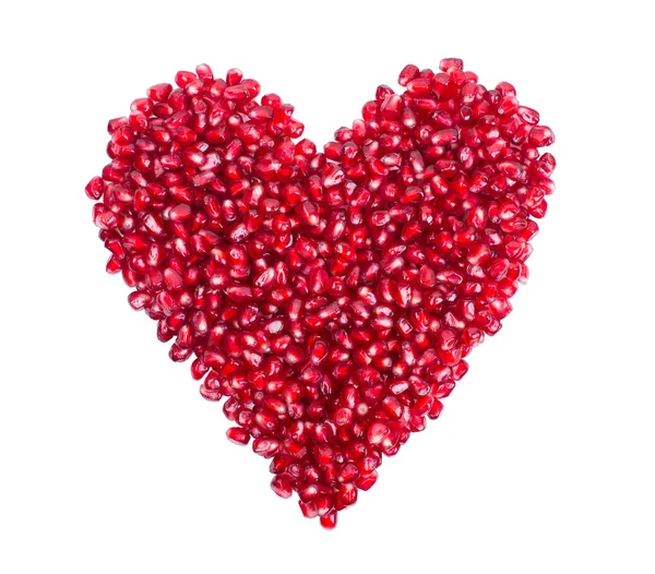 Garnet, grains, pomegranate seeds in the form of heart — Stock Photo, Image