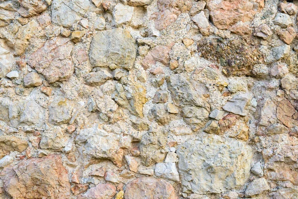 石墙用古老的石子和鹅卵石砌成的不平整的墙面 — 图库照片