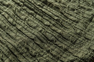 Eski, yeşil pamuklu, dokulu kumaşın soyut arkaplanı