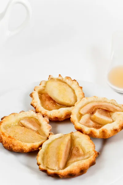 Homemade tartlets with poached pear — Stock Photo, Image