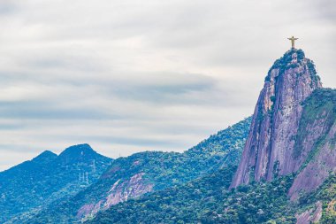 Cristo Redentor on the Corcovado mountain panorama view and forests of Alto da Boa Vista Rio de Janeiro Brazil. clipart