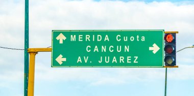 Playa del Carmen Mexico 21. December 2021 Green turquoise road sign at the highway in the city of Playa del Carmen Quintana Roo Mexico.