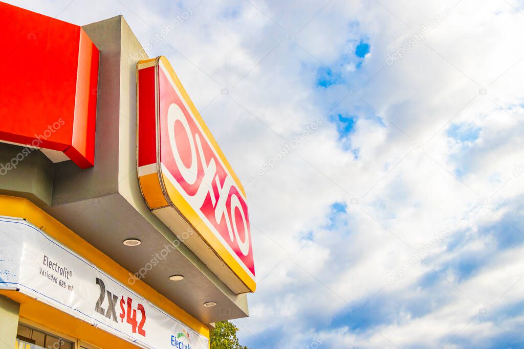 Playa del Carmen Mexico 21. December 2021 Oxxo supermarket and logo with blue cloudy sky in Playa del Carmen Mexico.