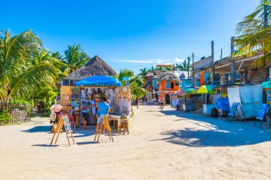 Holbox Mexico 21. December 2021 Panorama landscape view on beautiful Holbox island sandbank and beach with entrance people stores bars and palm trees in Quintana Roo Mexico.