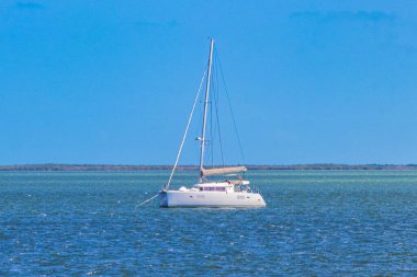 Panorama landscape view on beautiful Holbox island with luxury travel on boats yachts on turquoise water in Quintana Roo Mexico.