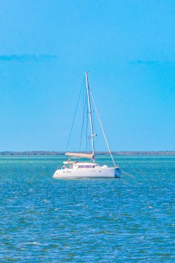 Panorama landscape view on beautiful Holbox island with luxury travel on boats yachts on turquoise water in Quintana Roo Mexico.