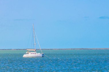 Panorama landscape view on beautiful Holbox island with luxury travel on boats yachts on turquoise water in Quintana Roo Mexico.