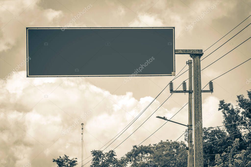 Old black and white picture of a blank empty road sign at the highway from Tulum to Muyil Chunyaxche Quintana Roo Mexico.