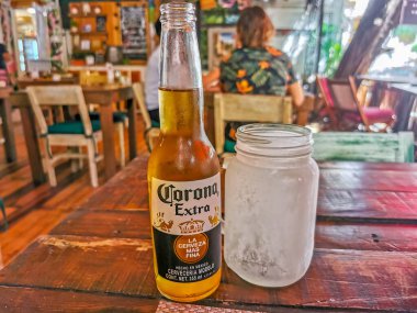 Playa del Carmen Mexico 26. March 2022 Corona beer bottle food and drink in the restaurant PapaCharly Papa Charly in Playa del Carmen Quintana Roo Mexico.
