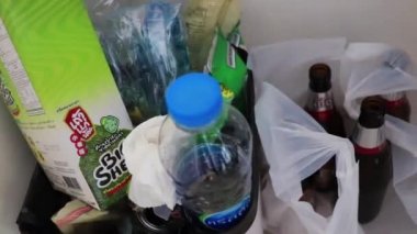 Samut Prakan Thailand 23. May 2018 Waking up hungover with a headache in the morning and garbage with alcohol beer bottles in apartment in Bangkok Thailand Asia.