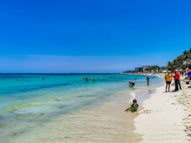 Playa del Carmen 14. May 2022 Tropical mexican beach landscape panorama full of people at beach parties on vacation in Playa del Carmen Mexico.