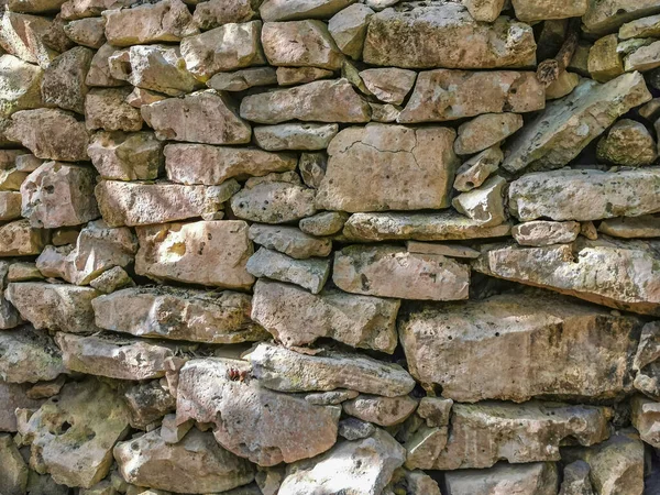 Texture and pattern of the ancient Tulum ruins Mayan site with temple ruins pyramids and artifacts in the tropical natural jungle forest palm and seascape panorama view in Tulum Mexico.