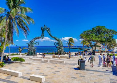 Playa del Carmen Mexico 14. May 2022 The ancient architecture of the Portal Maya in the Fundadores park with blue sky and turquoise seascape and beach panorama in Playa del Carmen Quintana Roo Mexico.