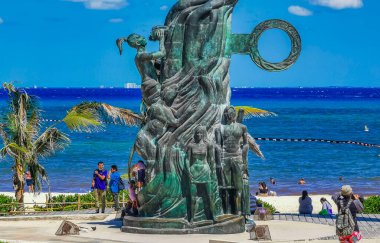 Playa del Carmen Mexico 14. May 2022 The ancient architecture of the Portal Maya in the Fundadores park with blue sky and turquoise seascape and beach panorama in Playa del Carmen Quintana Roo Mexico.