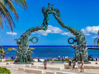 Playa del Carmen Mexico 14. May 2022 The ancient architecture of the Portal Maya in the Fundadores park with blue sky and turquoise seascape and beach panorama in Playa del Carmen Quintana Roo Mexico.