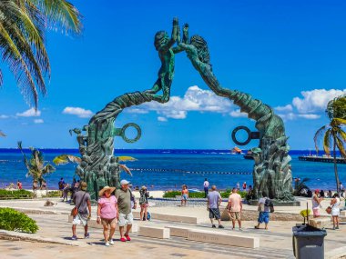 Playa del Carmen Mexico 14. May 2022 The ancient architecture of the Portal Maya in the Fundadores park with blue sky and turquoise seascape and beach panorama in Playa del Carmen Quintana Roo Mexico.