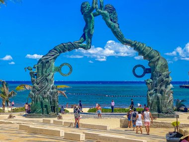 Playa del Carmen Mexico 14. May 2022 The ancient architecture of the Portal Maya in the Fundadores park with blue sky and turquoise seascape and beach panorama in Playa del Carmen Quintana Roo Mexico.