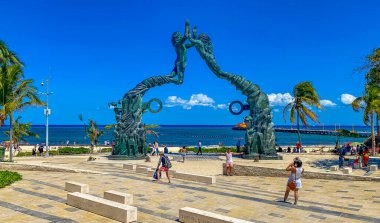 Playa del Carmen Mexico 14. May 2022 The ancient architecture of the Portal Maya in the Fundadores park with blue sky and turquoise seascape and beach panorama in Playa del Carmen Quintana Roo Mexico.